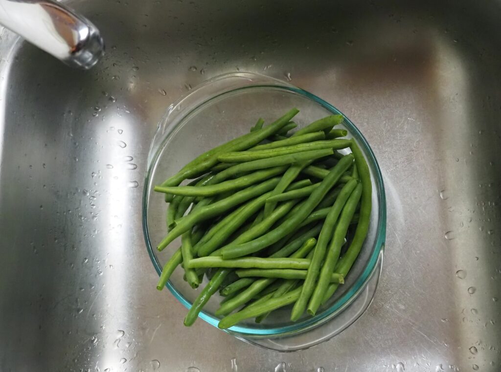 Cleaning the green beans.